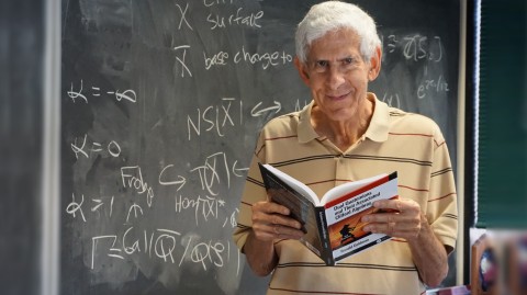 Faculty member Ron Goldman with his new book