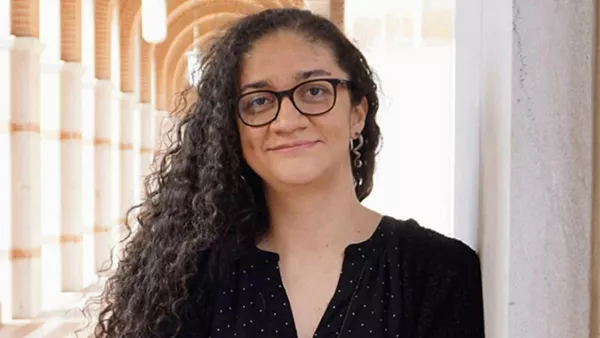 Paola Cascante-Bonilla stands outside in a cooridor on the Rice University campus