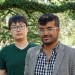 Tianyang Pan and Rahul Shome stand under a tree on campus at Rice University